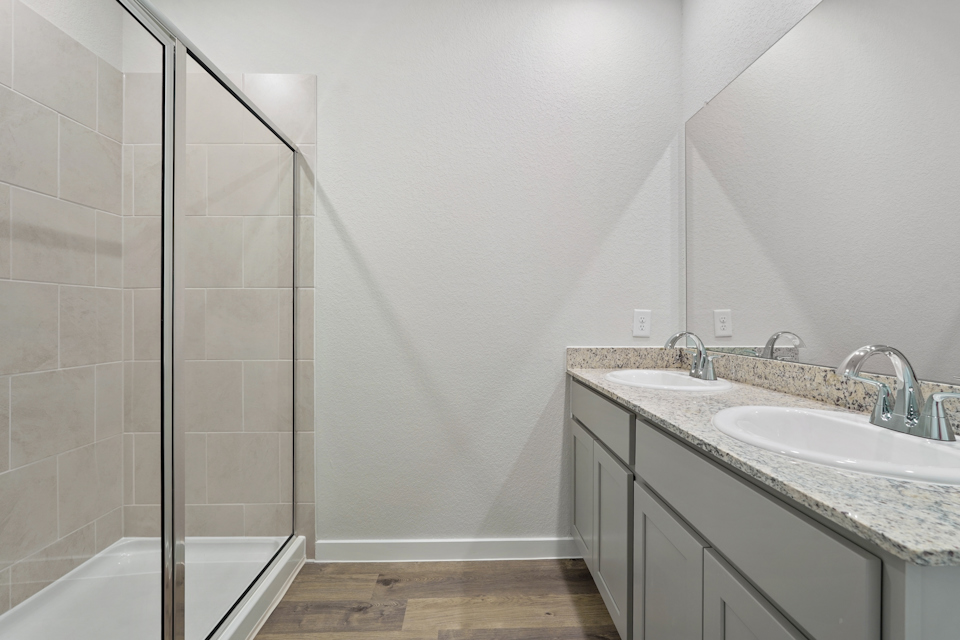A bathroom with a glass shower.
