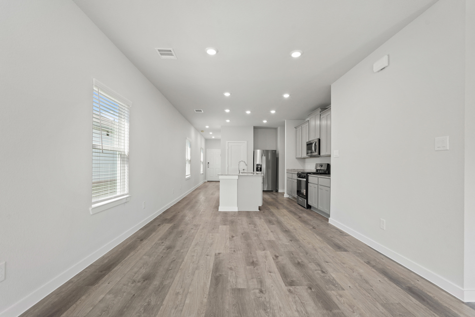 A kitchen with white walls.