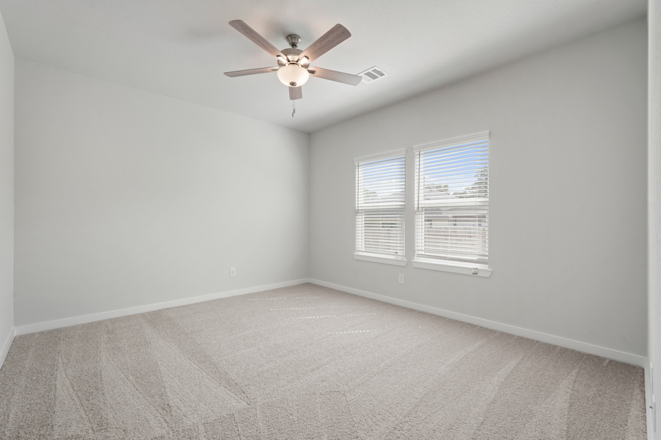 A ceiling fan in a room.