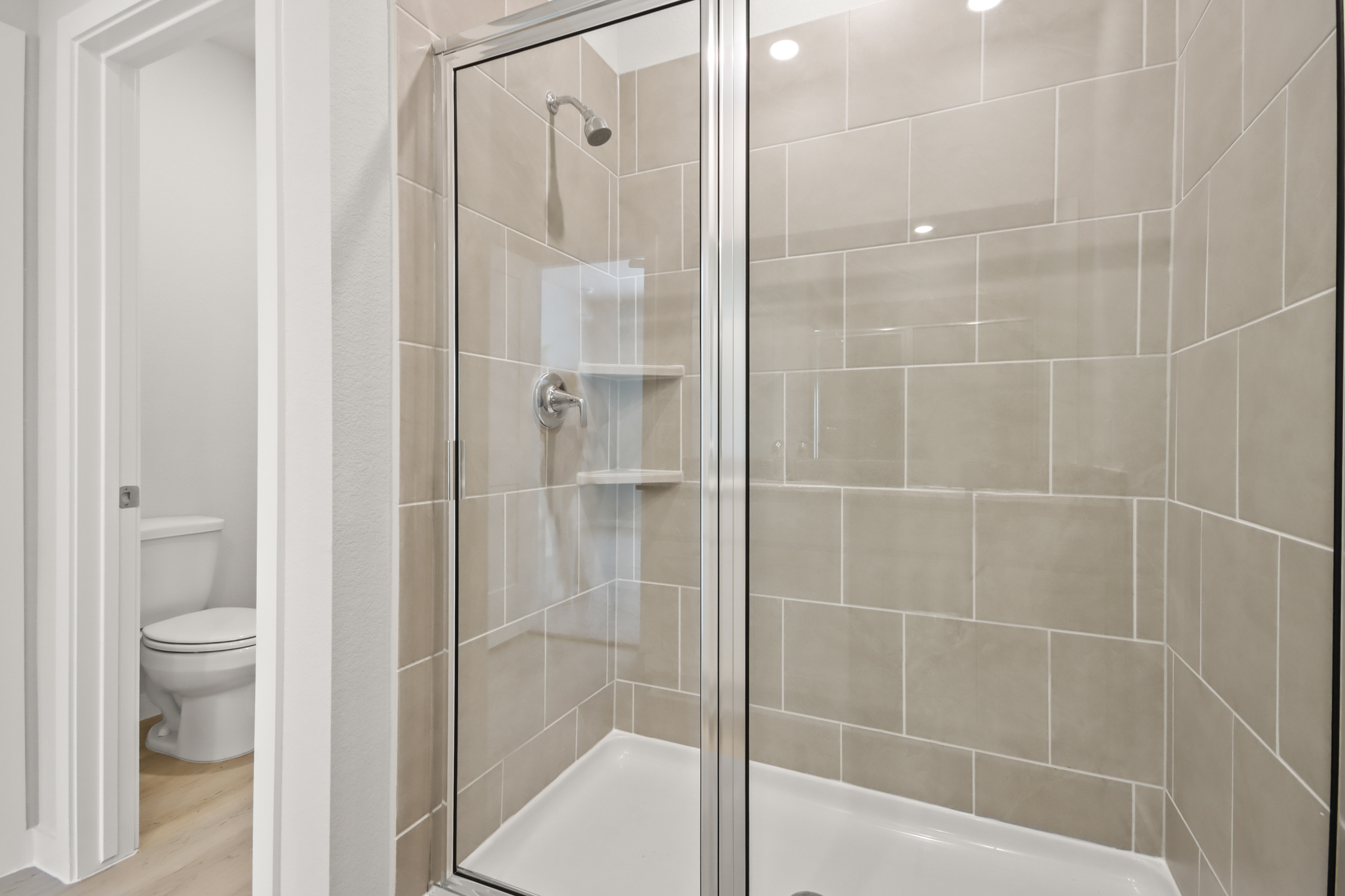 A bathroom with a glass shower.