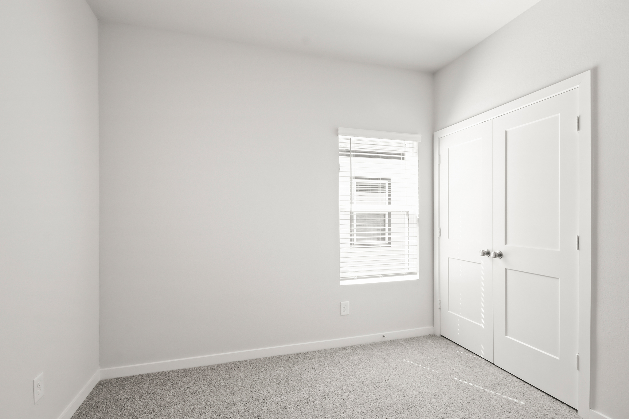 A room with white doors.