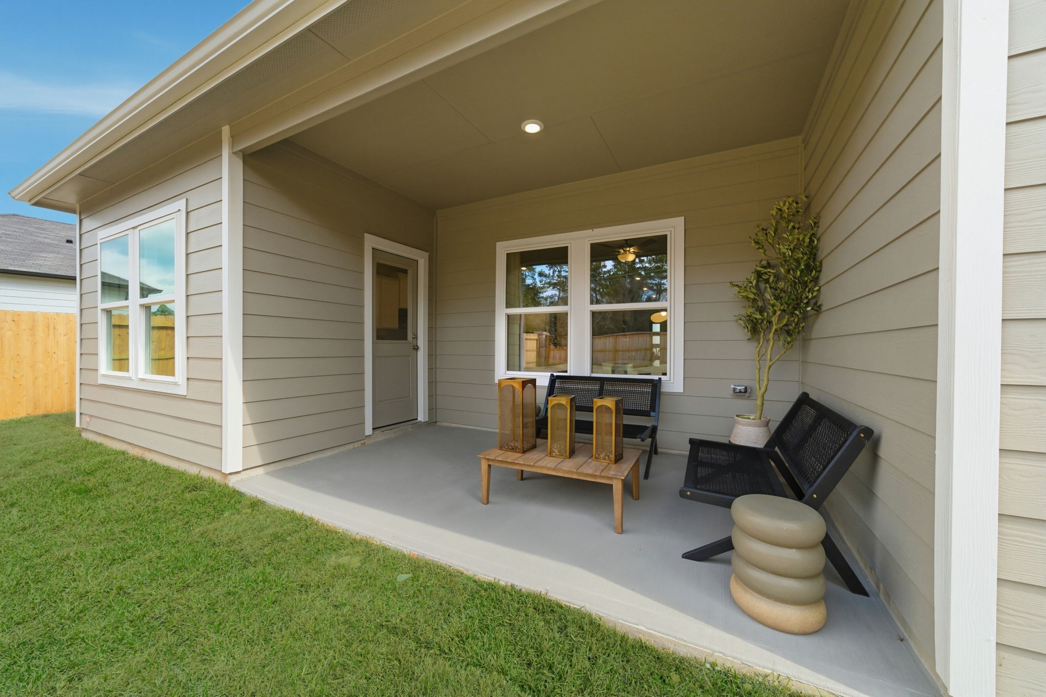 A house with a green lawn.