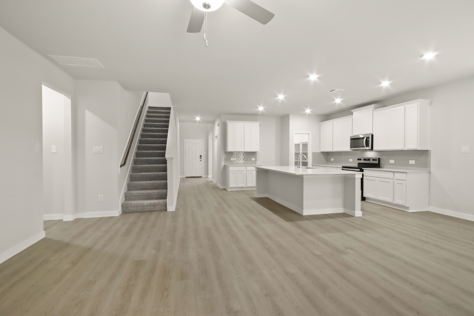 A large kitchen with white cabinets.