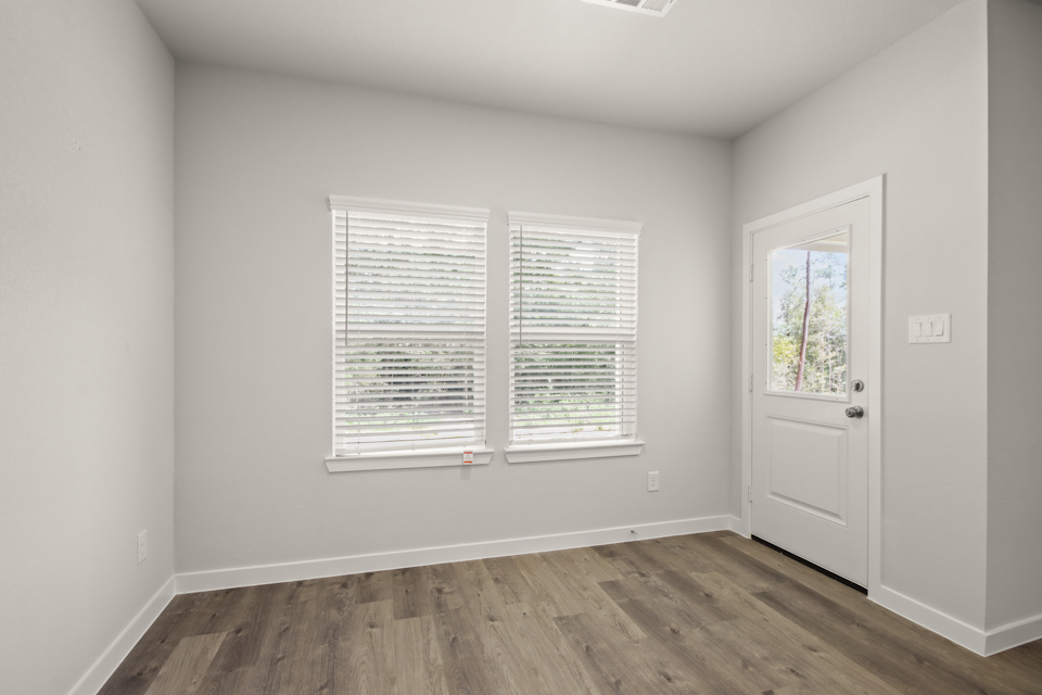 A room with a door and windows.