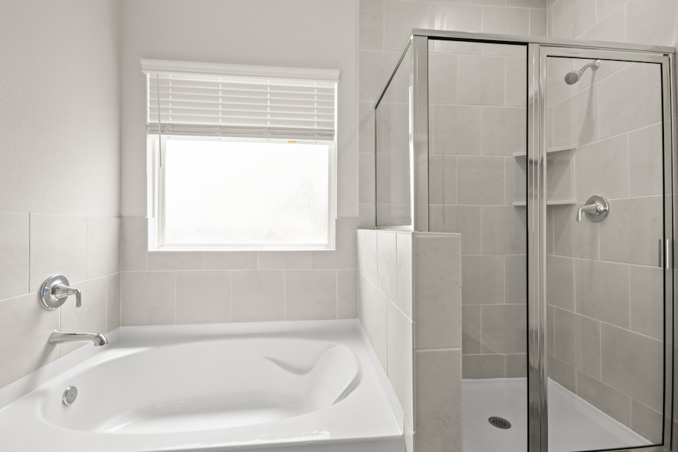A bathroom with a glass shower.