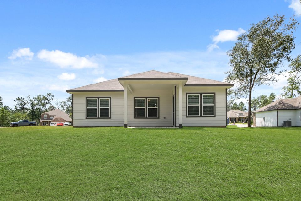 A house with a large lawn.