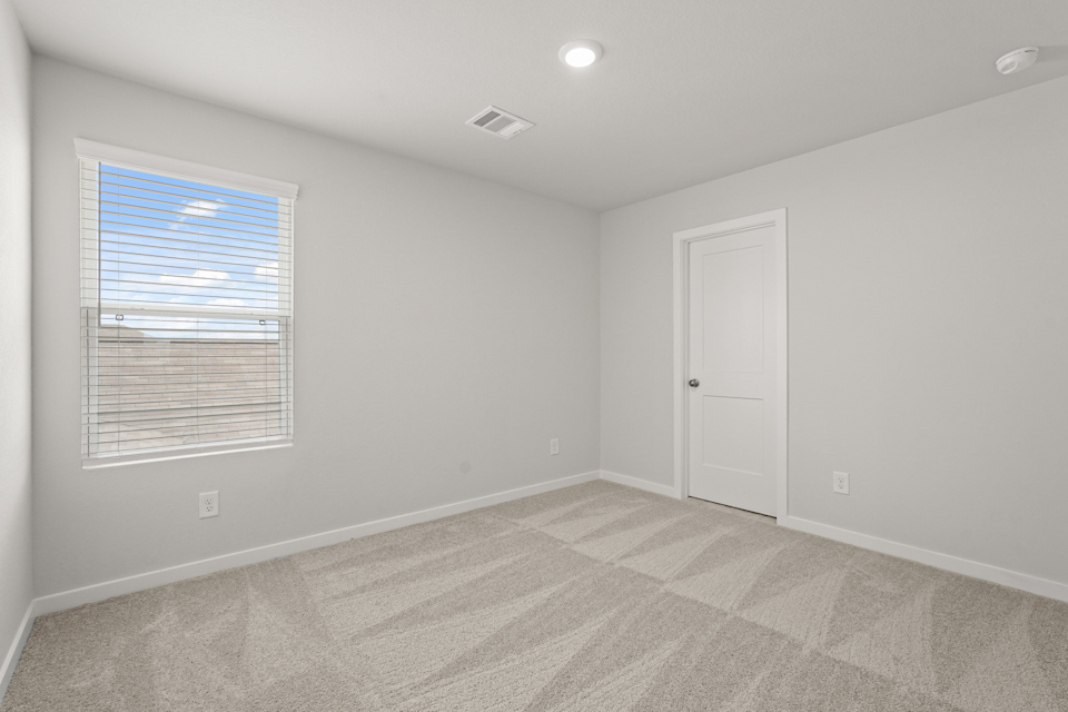 A room with a door and a window.