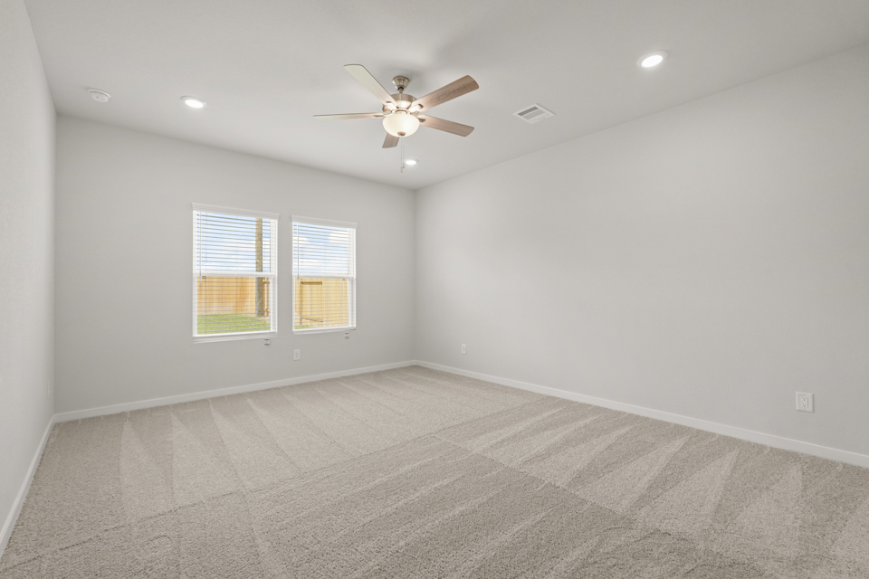 A room with a ceiling fan and a ceiling fan.