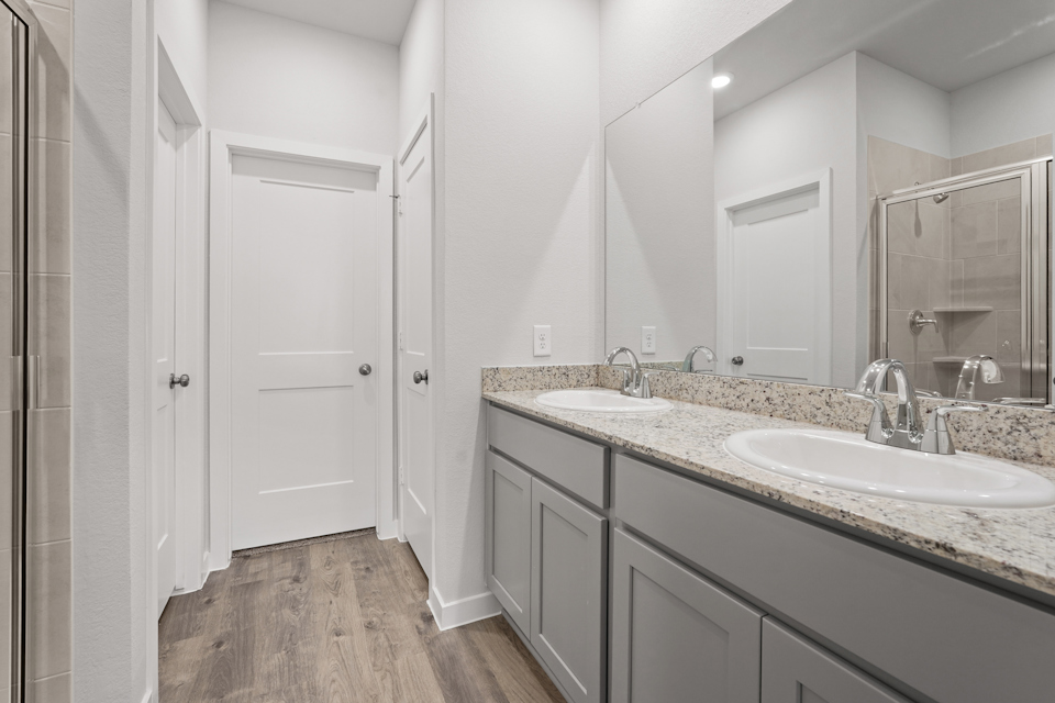 A bathroom with a marble countertop.