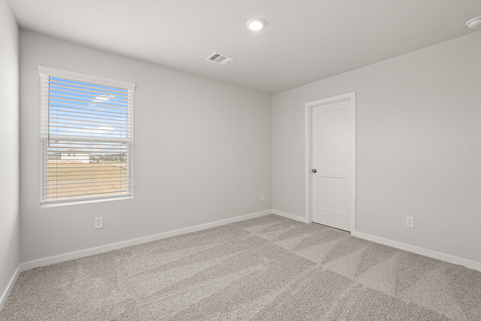 A room with a door and a window.