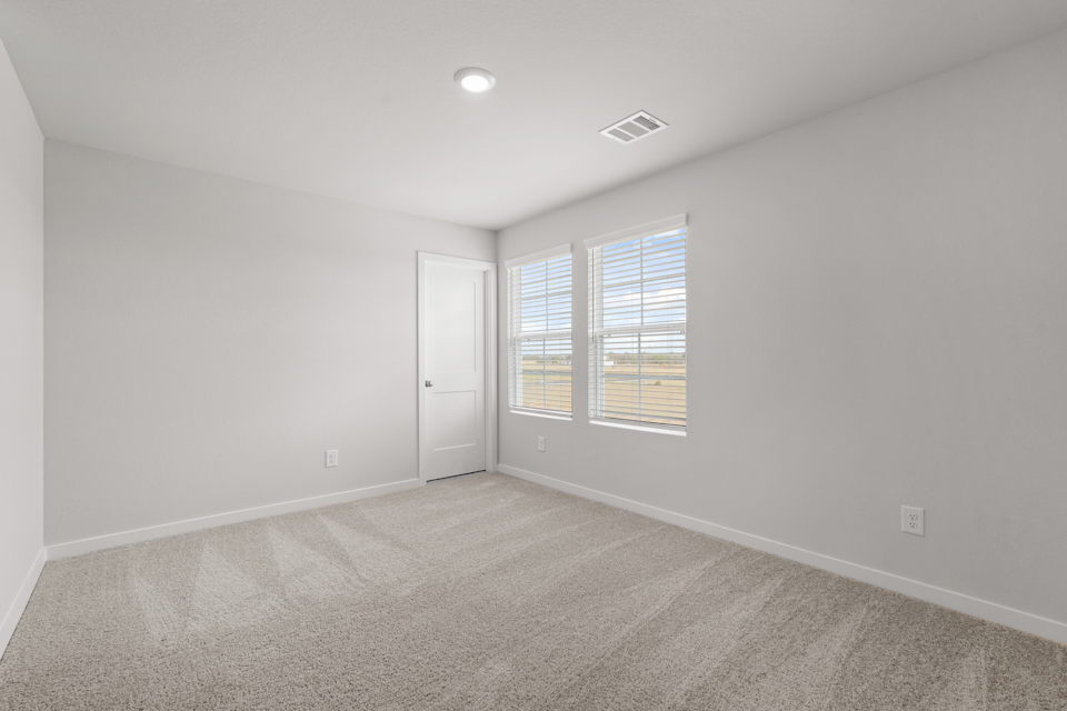 A room with a door and windows.