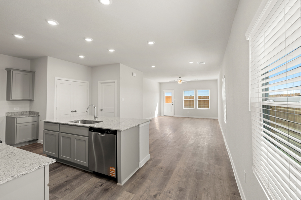 A kitchen with a wood floor.