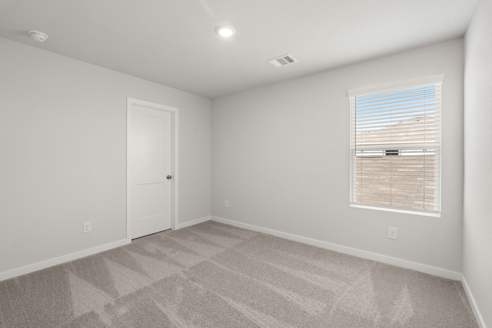 A room with a door and a window.