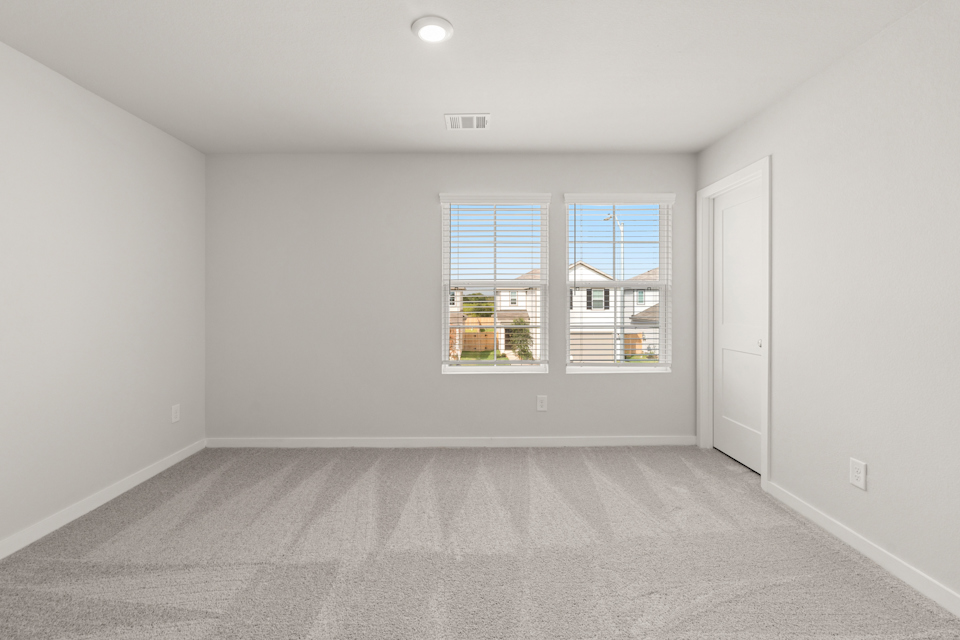 A room with a window and a door.