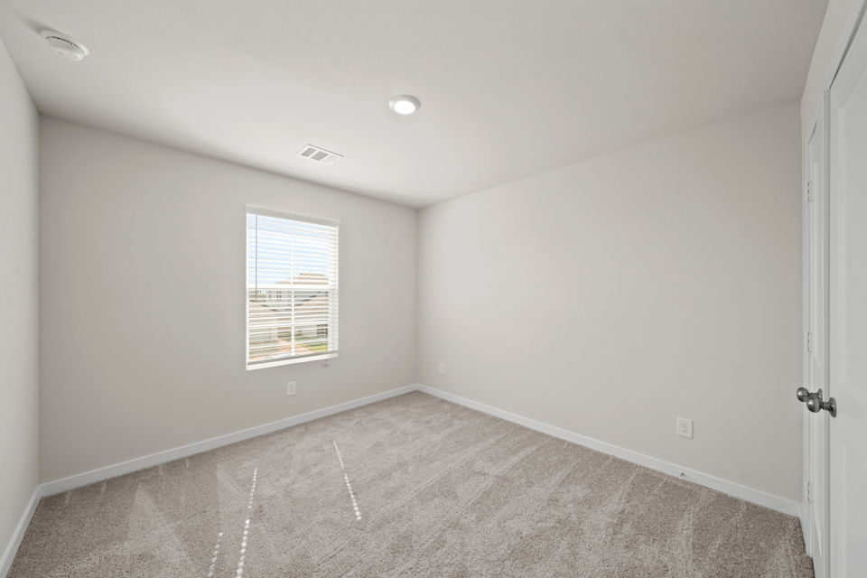 A room with a door and a window.