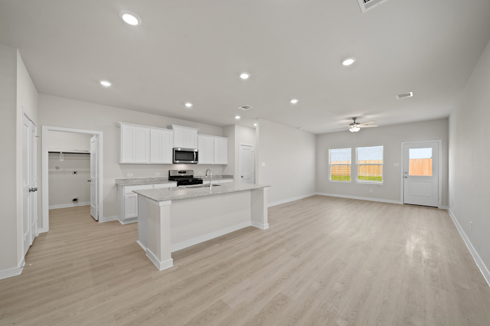 A large kitchen with white cabinets.
