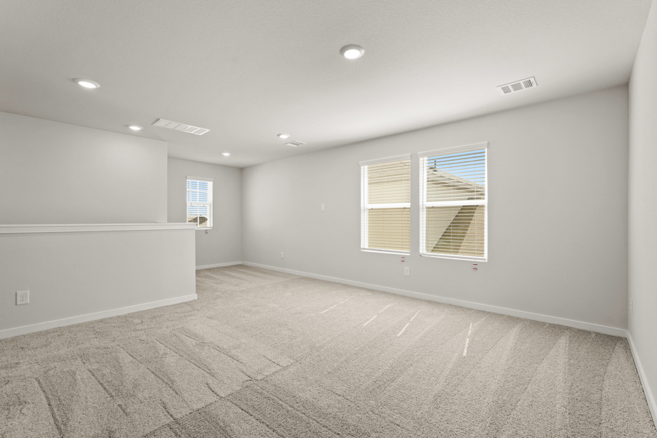 A room with a tile floor and windows.