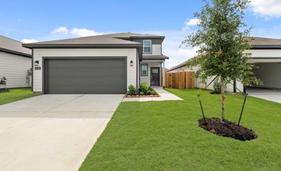 A house with a green lawn.