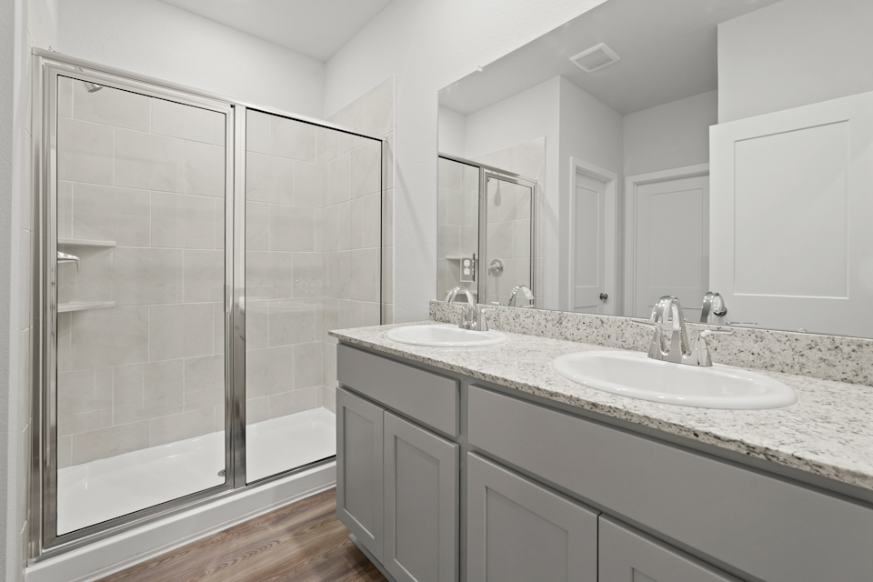 A bathroom with a glass shower.