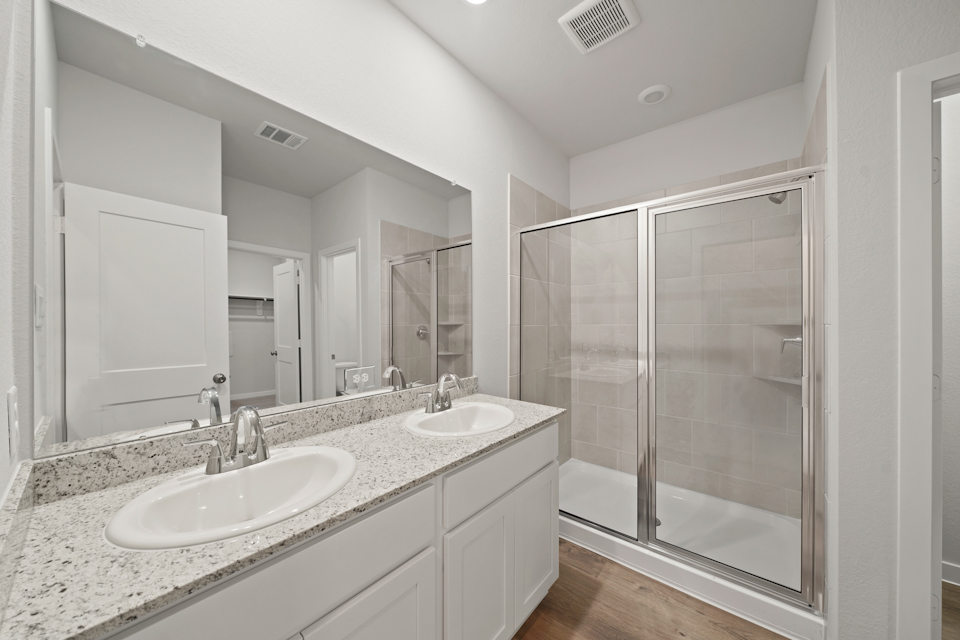 A bathroom with a glass shower.