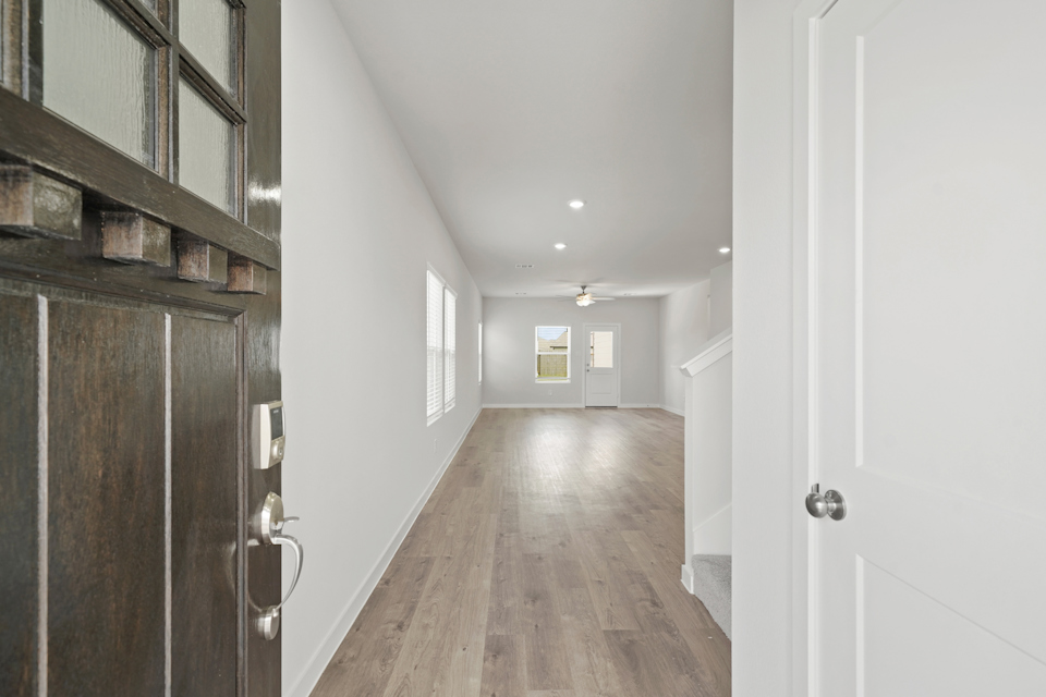 A hallway with white walls.