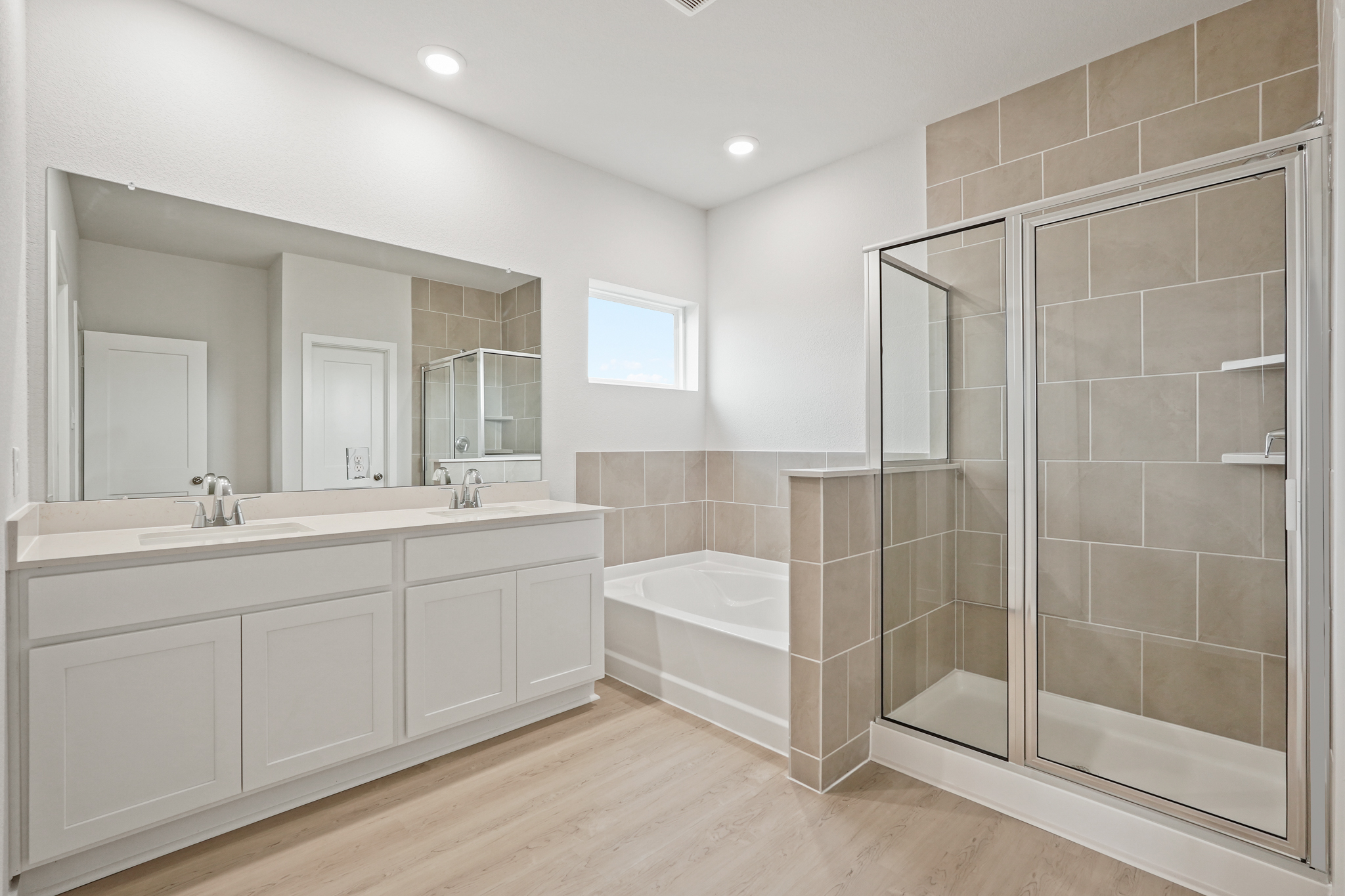 A bathroom with a glass shower.