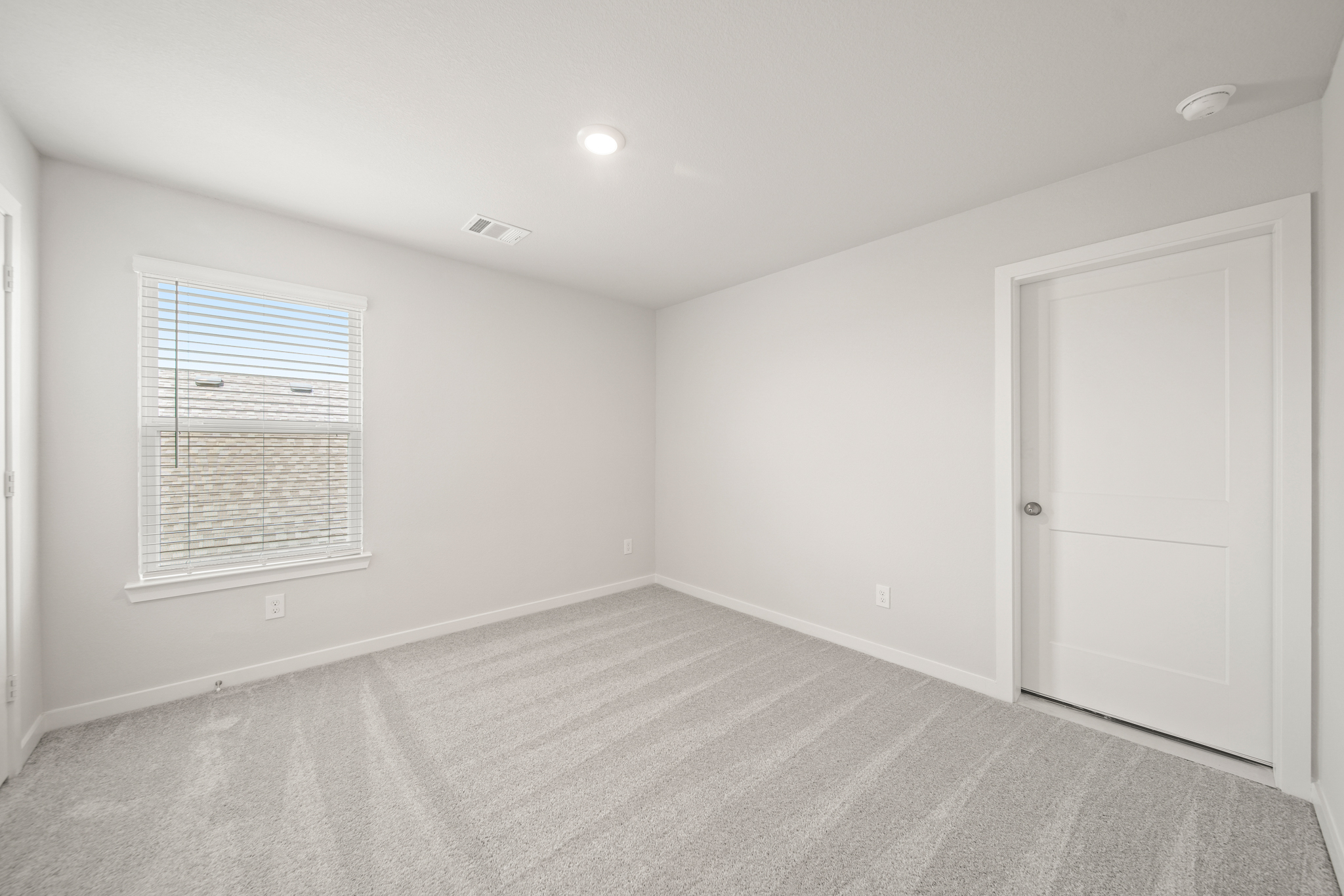 A room with a door and a window.