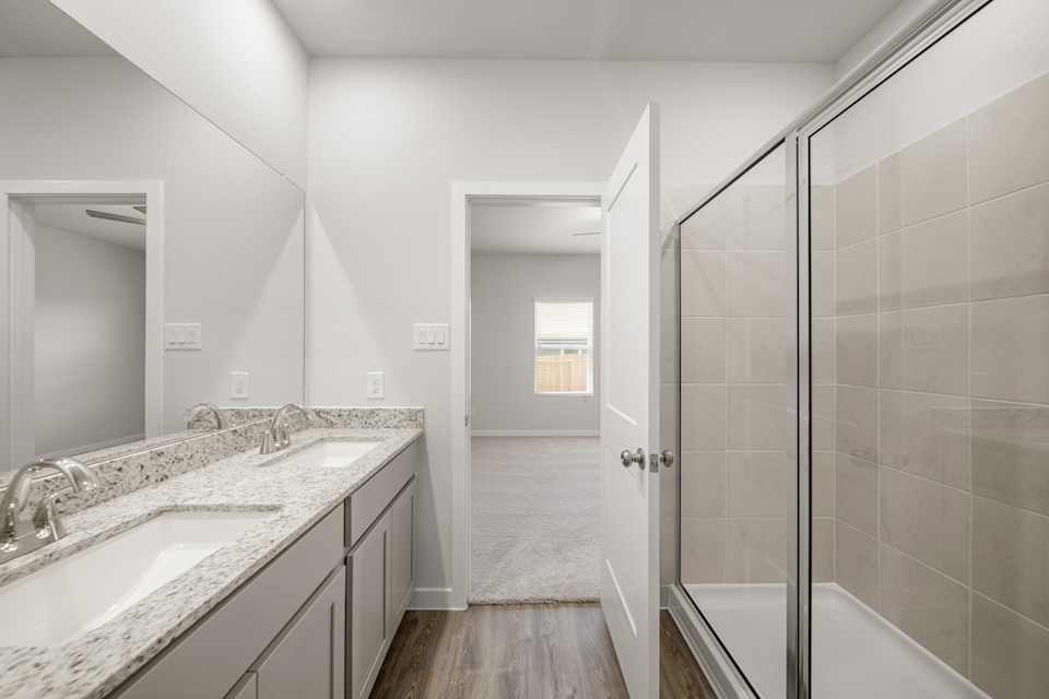 A bathroom with a glass shower.