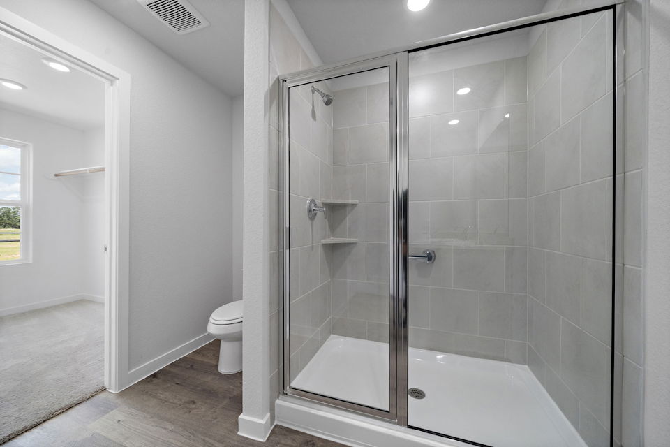 A bathroom with a glass shower.