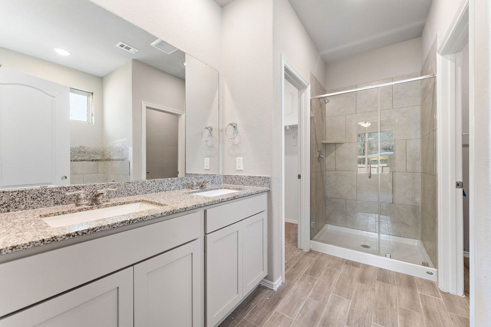 A bathroom with a marble countertop.
