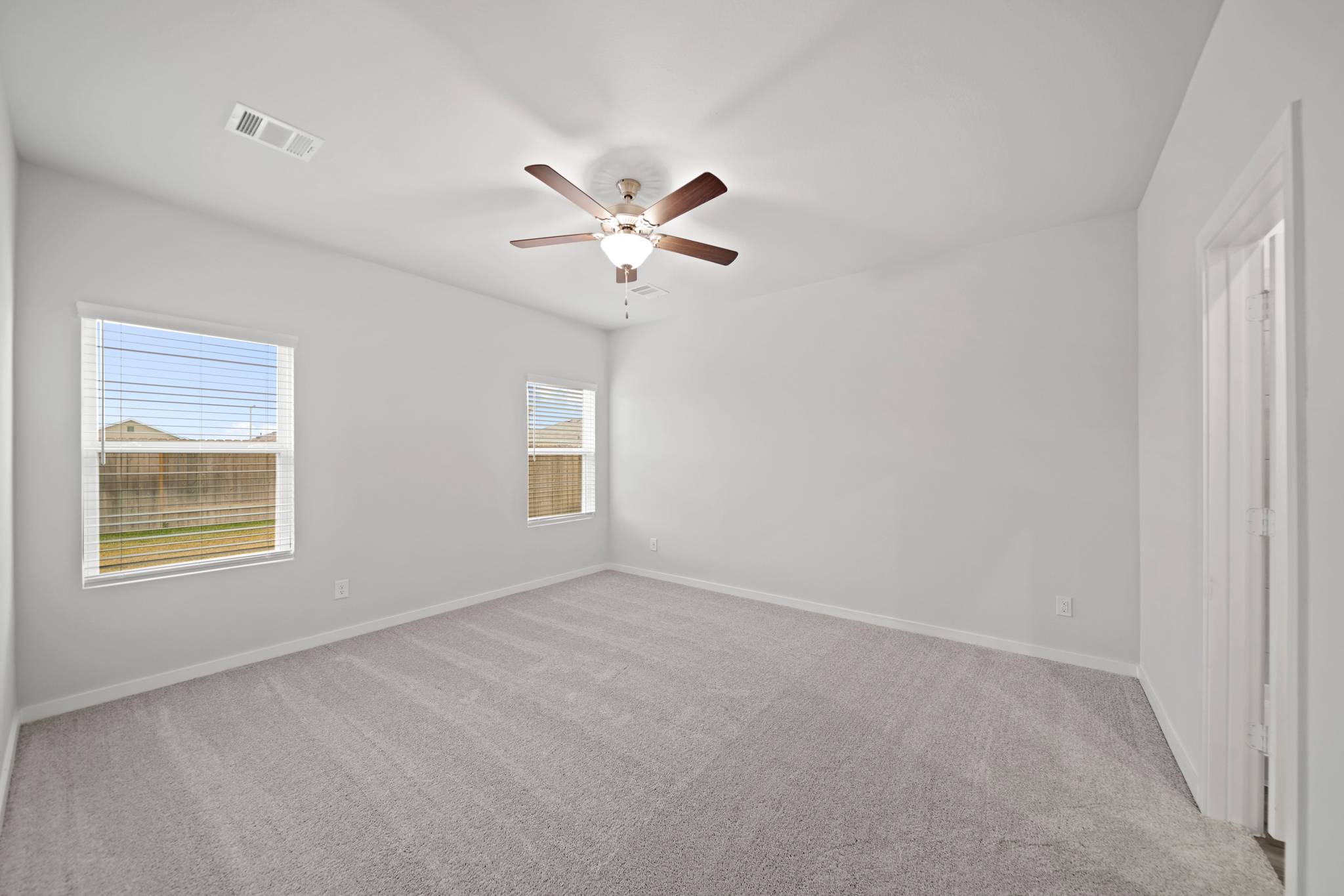 A ceiling fan in a room.