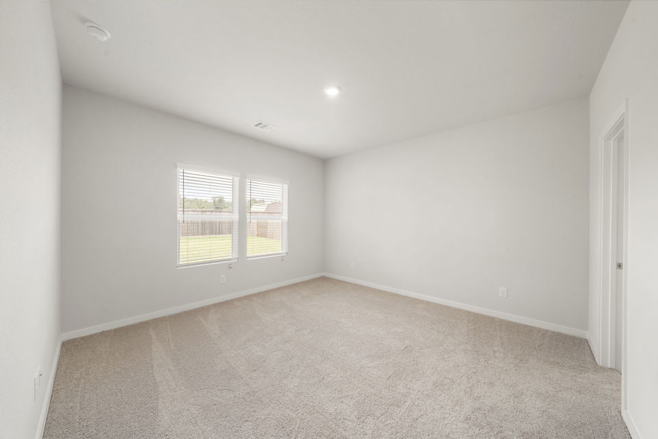 A room with a window and a door.