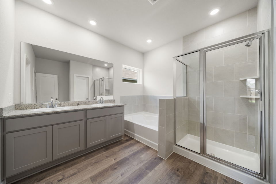 A bathroom with a glass shower.