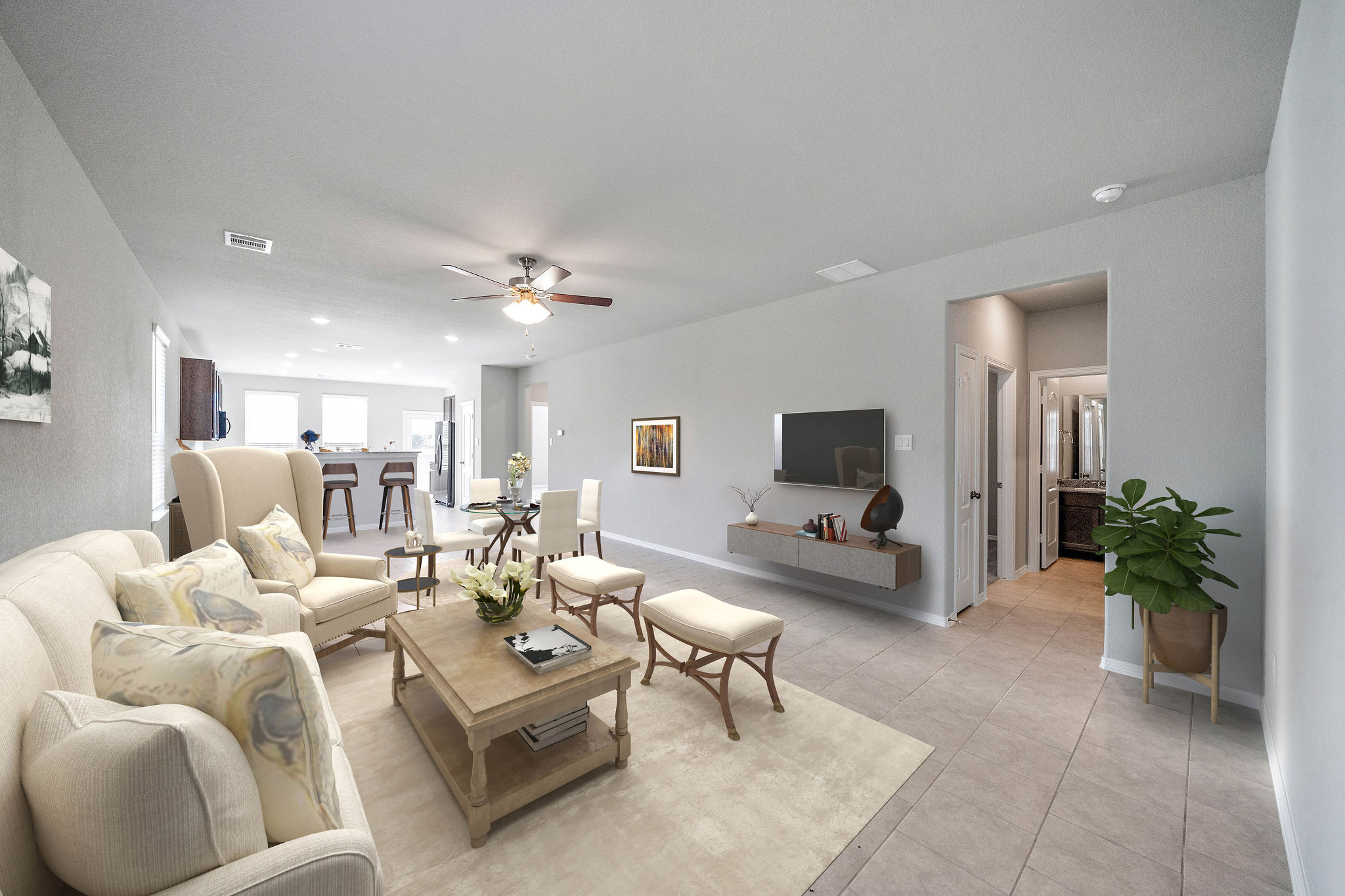 A living room with white furniture.