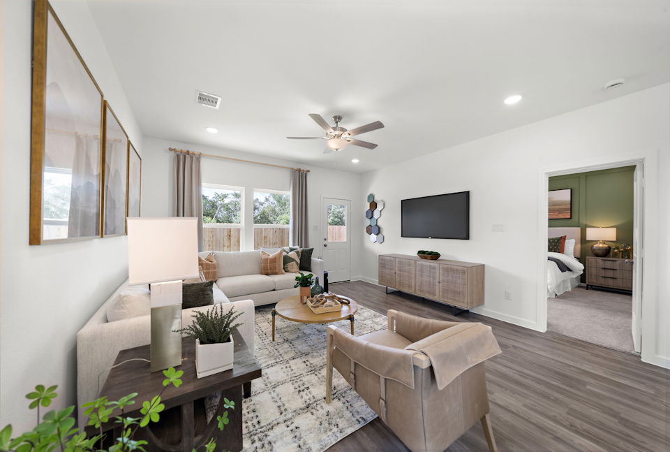 A living room with a large tv and a couch.