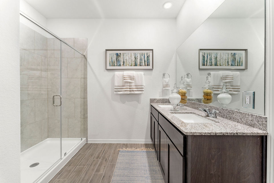 A bathroom with a glass shower.
