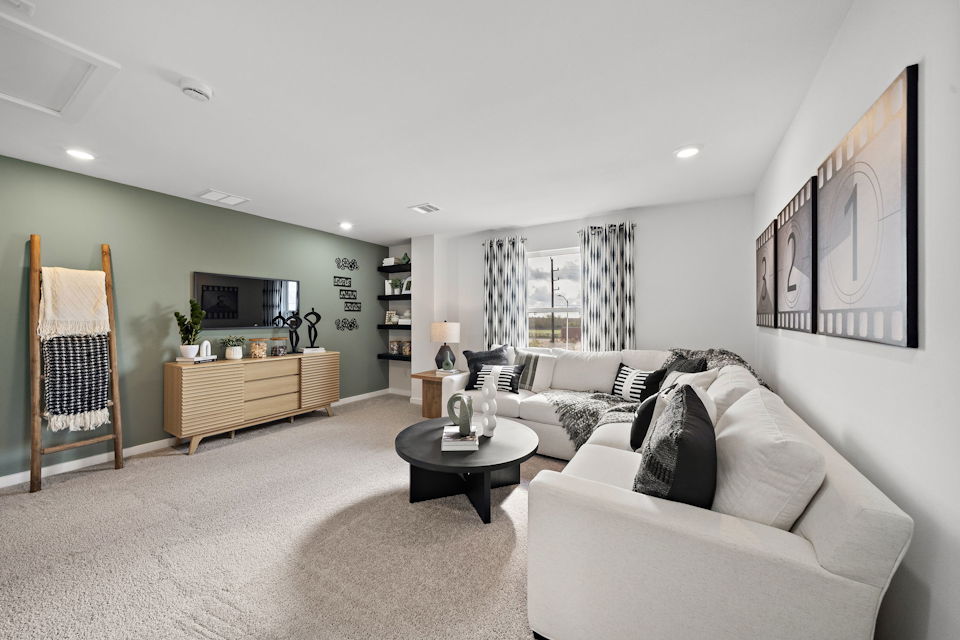 A living room with a couch and a table.