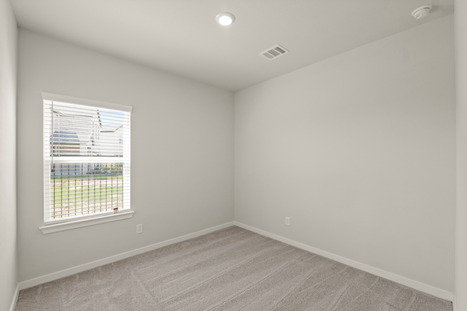 A room with a window and a door.