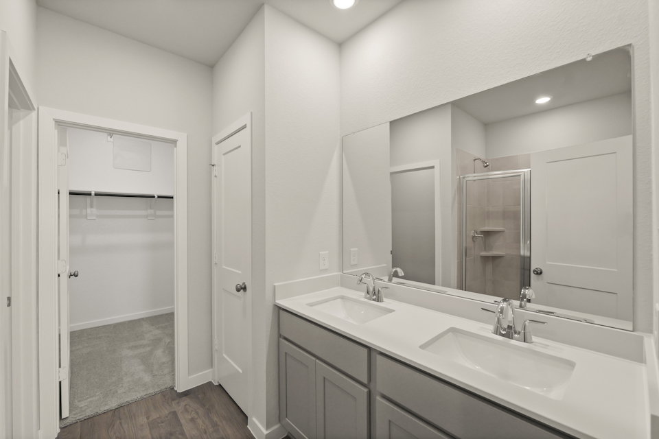 A bathroom with a glass shower.