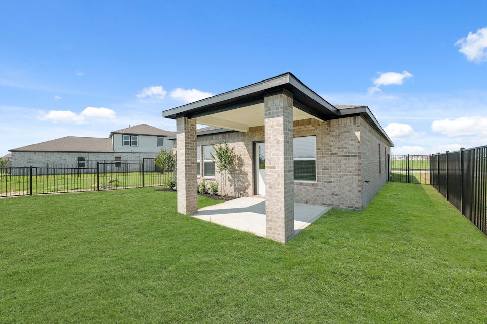 A house with a fence around it.