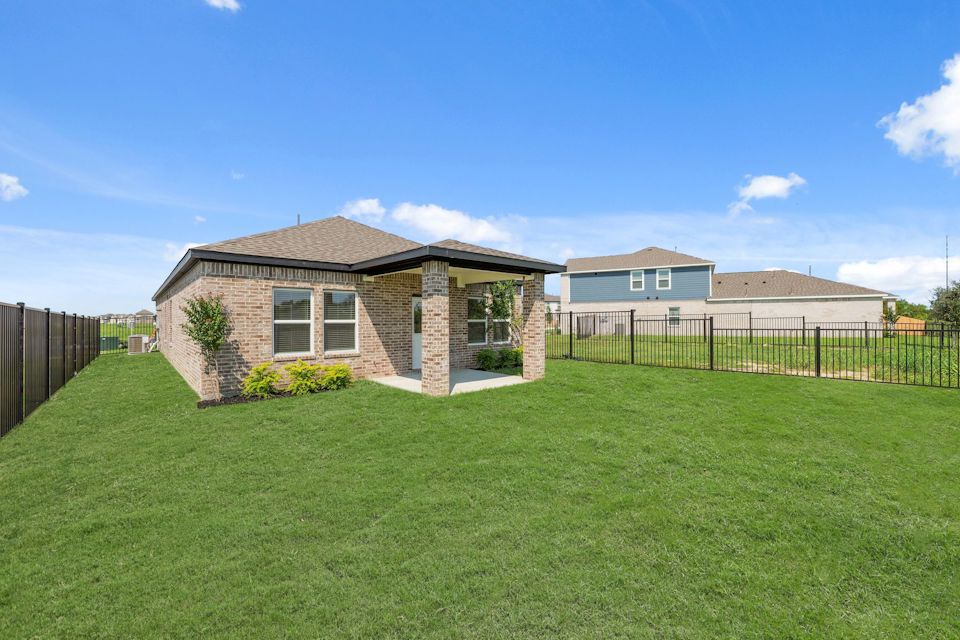 A house with a fence around it.