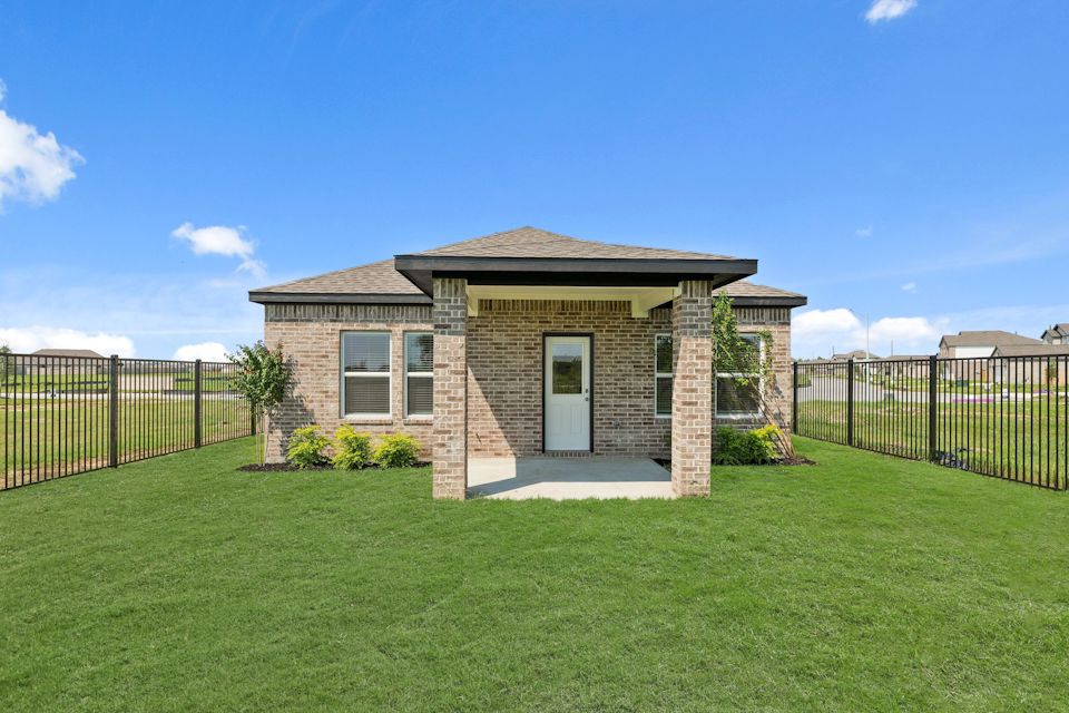 A small house in a yard.