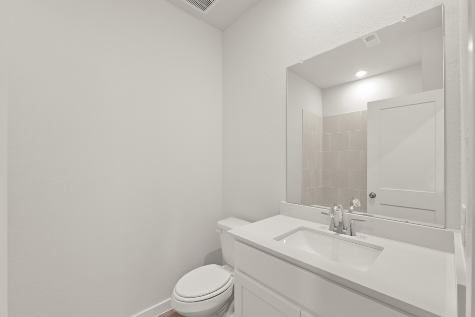 A bathroom with a sink and a toilet.