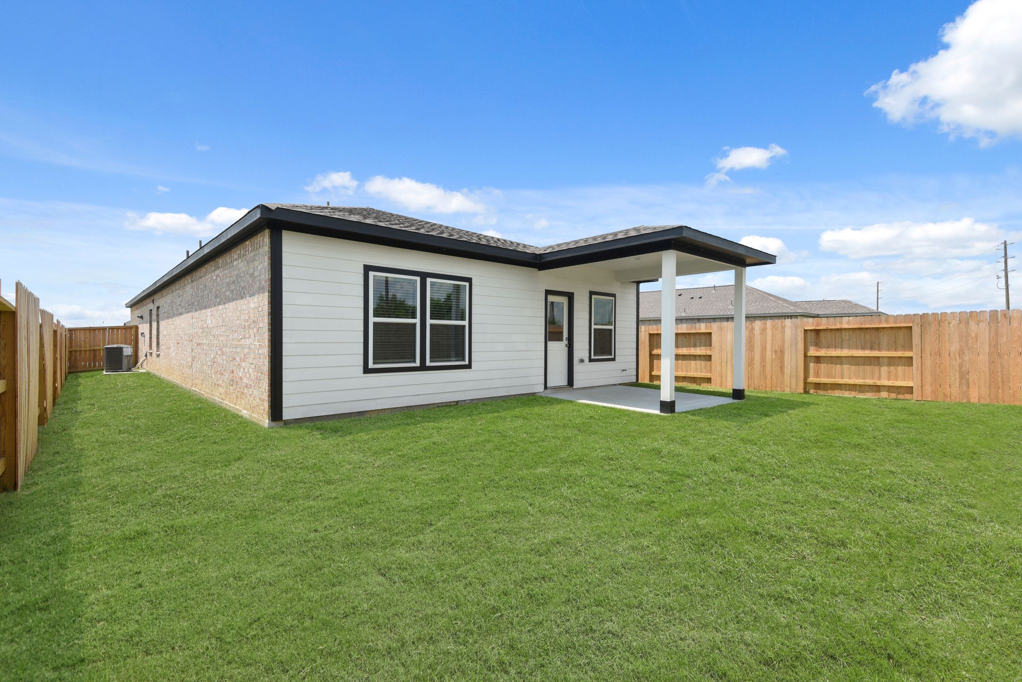 A house with a grass yard.