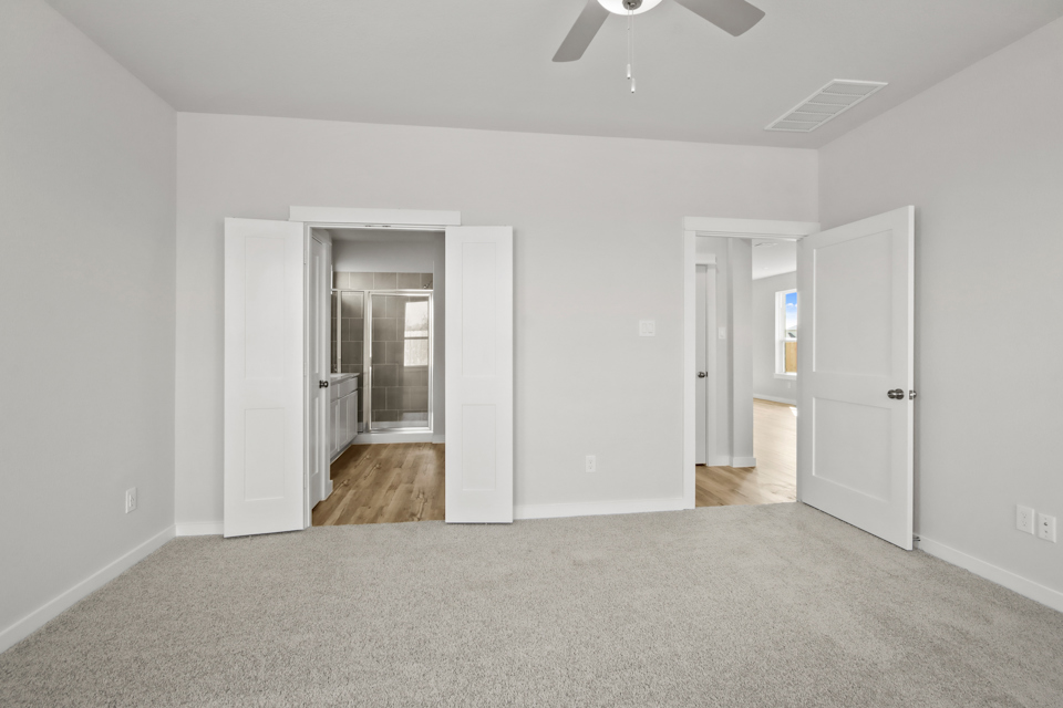 A room with white walls and a wood floor.