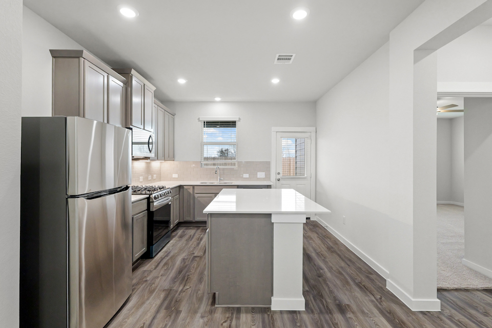 A kitchen with a large island.