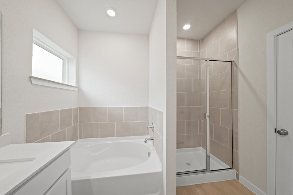 A bathroom with a glass shower.