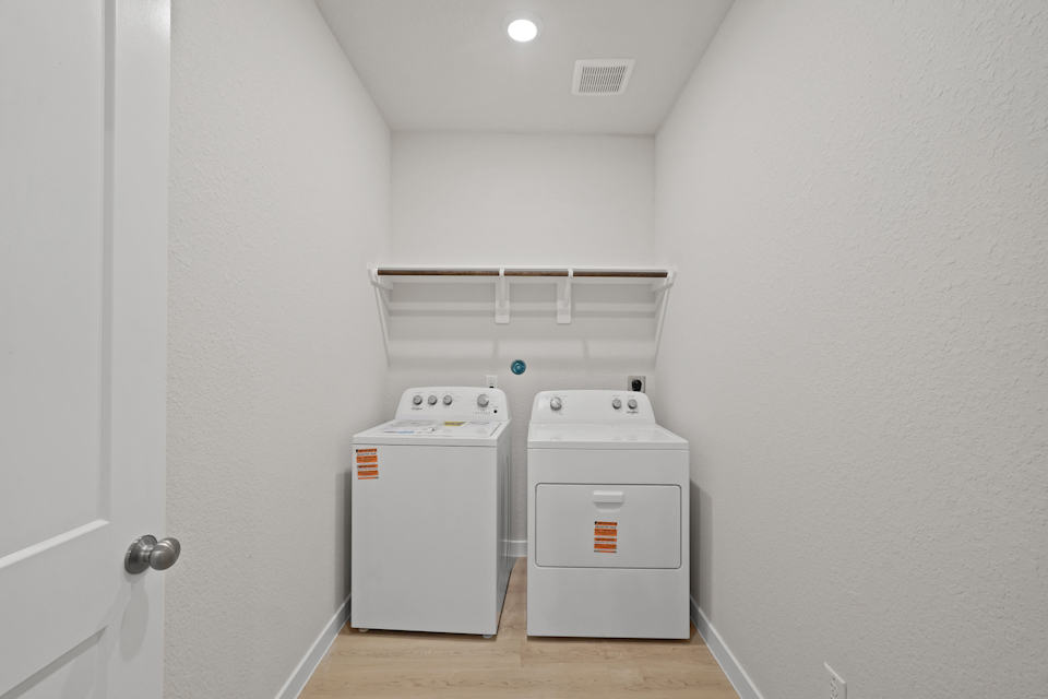 A laundry room with a washer and dryer.