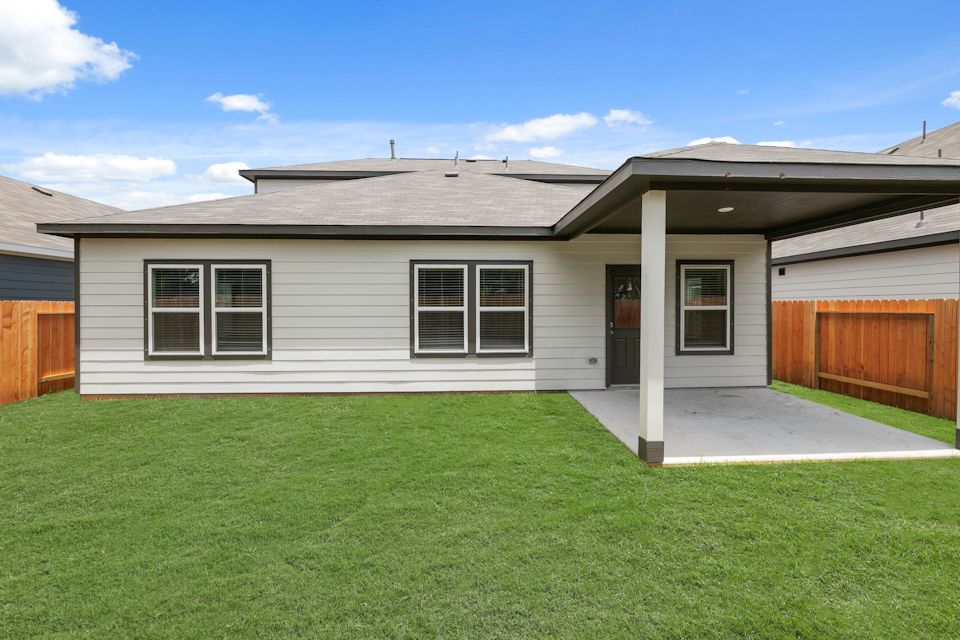 A house with a green lawn.