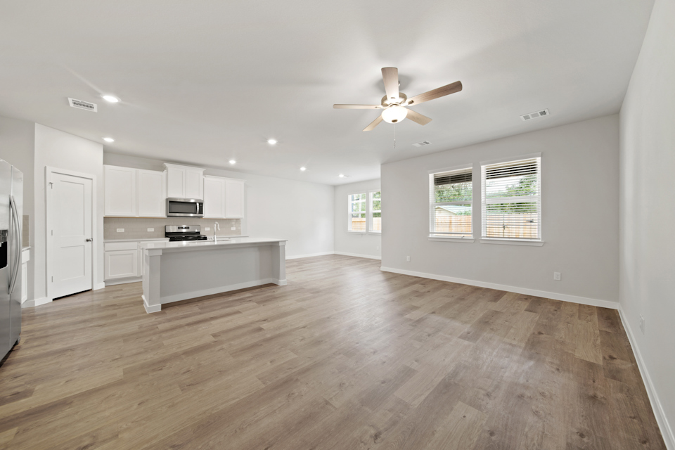 A large kitchen with white cabinets.
